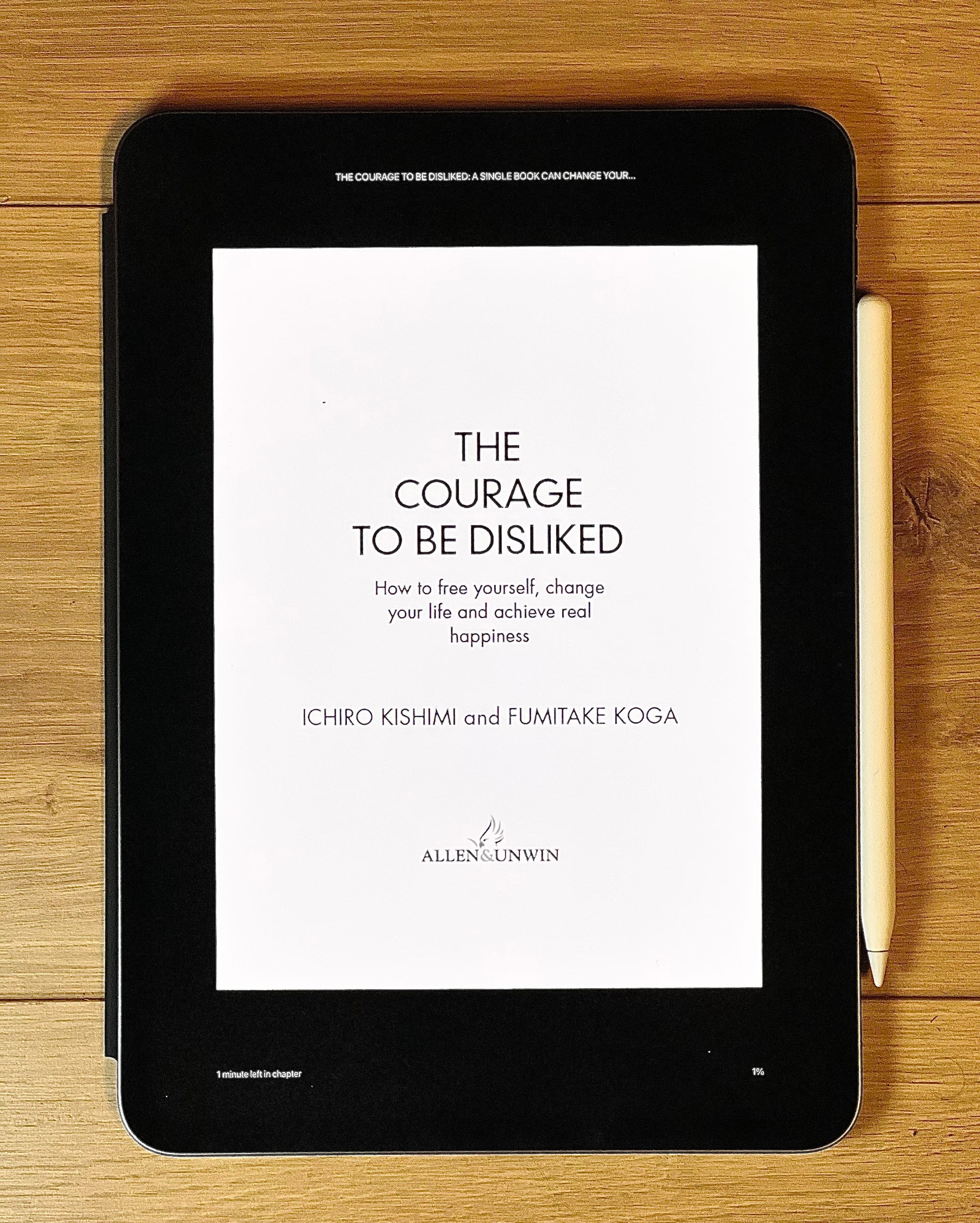 Photo of an iPad with The Courage to be Disliked book cover open